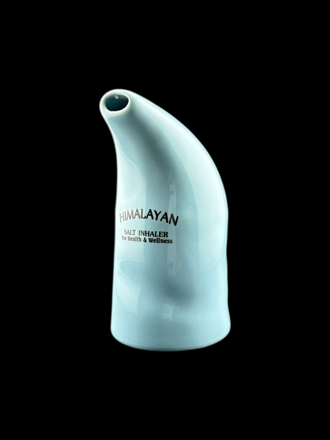 a white salt inhaler on a black background